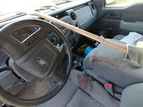 A Saskatoon man says he was cut on the forehead and sustained a concussion after an axe came flying through his truck's windshield, shown in a handout photo.