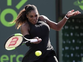 Serena Williams returns to Naomi Osaka during the Miami Open on Wednesday, March 21, 2018. (AP Photo/Lynne Sladky)