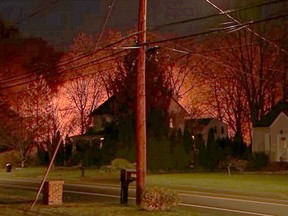 This image provided by WFSB-TV shows a fire behind a house in North Haven, Conn., Wednesday, May 2, 2018.  (WFSB-TV via AP)