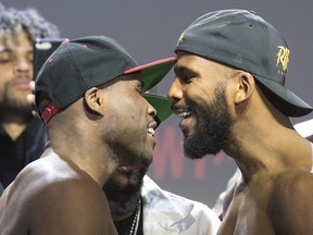 Canadian boxer Adonis (Superman) Stevenson, left, and Badou Jack square up after their weigh-in, in Toronto on Friday, May 18, 2018. (THE CANADIAN PRESS/Chris Young)