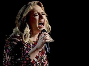 FILE - In this Feb. 12, 2017, file photo, Adele performs "Hello" at the 59th annual Grammy Awards in Los Angeles.