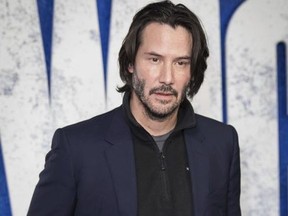 Actor Keanu Reeves poses for photographers upon arrival for the screening of the film 'John Wick: Chapter 2', in London, Friday, Feb. 10, 2017.