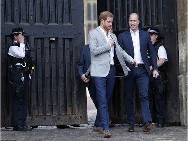 Britain's Prince William, right, and Prince Harry leave Windsor Castle to greet the crowds near London, England, Friday, May 18, 2018. Preparations continue in Windsor ahead of the royal wedding of Britain's Prince Harry and Meghan Markle on Saturday May 19.