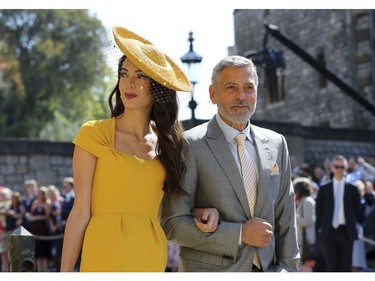 Amal Clooney and George Clooney arrive for the wedding ceremony of Prince Harry and Meghan Markle at St. George's Chapel in Windsor Castle in Windsor, near London, England, Saturday, May 19, 2018. (Gareth Fuller/pool photo via AP) ORG XMIT: RWW124