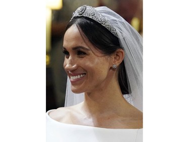 Meghan Markle looks at Prince Harry during their wedding ceremony at St. George's Chapel in Windsor Castle in Windsor, near London, England, Saturday, May 19, 2018. (Gareth Fuller/pool photo via AP) ORG XMIT: RWW847