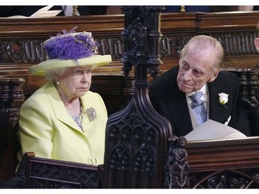 Britain's Queen Elizabeth and Prince Phillip during the wedding ceremony of Prince Harry and Meghan Markle at St. George's Chapel in Windsor Castle in Windsor, near London, England, Saturday, May 19, 2018. (Jonathan Brady/pool photo via AP) ORG XMIT: RWW868