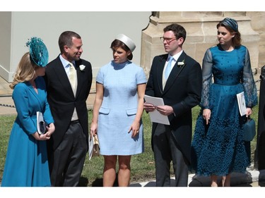 From left, Autumn Phillips, Peter Phillips, Princess Eugenie, her fiance Jack Brooksbank and Princess Beatrice stand, after the wedding ceremony of Prince Harry and Meghan Markle at St. George's Chapel in Windsor Castle in Windsor, near London, England, Saturday, May 19, 2018. (Andrew Milligan/pool photo via AP) ORG XMIT: RWW660