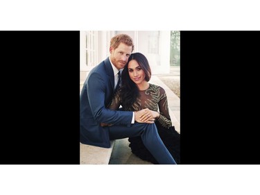 In this photo released by Kensington Palace on Thursday, Dec. 21, 2017, Britain's Prince Harry and Meghan Markle pose for one of two official engagement photos, at Frogmore House, in Windsor, England. (Alexi Lubomirski via AP) ORG XMIT: AMB805