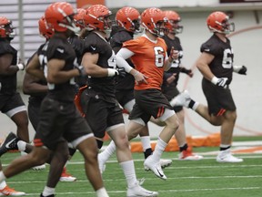 Cleveland Browns quarterback Baker Mayfield (6) runs a drill during rookie minicamp at the team's training camp facility in Berea, Ohio on May 4, 2018. (AP Photo/Tony Dejak)