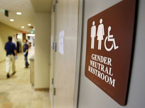 In this Aug. 23, 2007, file photo, a sign marks the entrance to a gender-neutral restroom at the University of Vermont in Burlington, Vt.