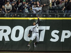 Centrefielder Byron Buxton of the Minnesota Twins leaps into the outfield wall to try to catch a home run by Nelson Cruz of the Seattle Mariners at Safeco Field on May 26, 2018 in Seattle. (Stephen Brashear/Getty Images)
