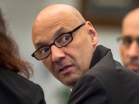 In this March 21, 2018 photo,  Andrew Urdiales  looks back into the courtroom gallery as opening statements began his trial in Santa Ana, Calif.