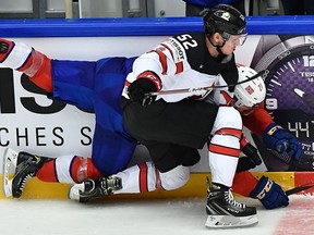 Canada's Thomas Chabot (front) hits Norway's Steffen Thoresen during the World Hockey Championship at the Jyske Bank Boxen in Herning, Denmark, on May 10, 2018. (Getty Images)