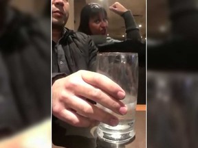In this screenshot, a woman is seen arguing with other customers at a Lethbridge Denny's.