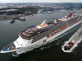 In this Feb. 23, 2004 file photo, the Carnival Miracle sails up the St. John's River in Jacksonville, Fla., after a trans-Atlantic voyage from its Italian shipyard. (Andy Newman/Carnival Cruise Lines/HO)