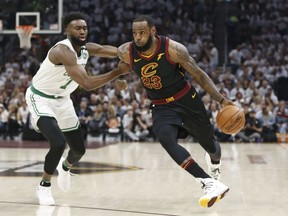 Cleveland Cavaliers' LeBron James (23) drives past Boston Celtics' Jaylen Brown (7) during Game 6 of the NBA Eastern Conference finals Friday, May 25, 2018, in Cleveland.