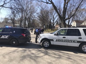 This photo provided by KVLY-TV/Fargo show authorities at the scene in Grand Forks, N.D., Thursday, May 3, 2018, after a police officer making a welfare check found four people, three elementary school children and a parent, dead inside a home.