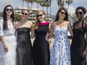 Actresses Fan Bingbing, from left, Marion Cotillard, Jessica Chastain, Penelope Cruz and Lupita Nyong'o pose for photographers during a photo call for the film '355' at the 71st international film festival, Cannes, southern France, Thursday, May 10, 2018.