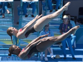 Canada's Jennifer Abel, front, and Melissa Citrini-Beaulieu perform in the women's 3m synchro springboard final at the Commonwealth Games in Gold Coast, Australia, on April 11.