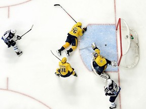 Winnipeg Jets left wing Kyle Connor  scores a goal against Nashville Predators goalie Pekka Rinne, of Finland, during the second period in Game 5 of an NHL hockey second-round playoff series Saturday, May 5, 2018, in Nashville, Tenn. (AP Photo/Mark Humphrey)