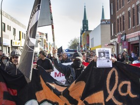 Anti-fascist protesters march toward the home of neo-Nazi Zeiger in the Rosemont borough of Montreal on Saturday May 12, 2018.