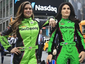 Danica Patrick, left, poses with a life-size Lego statue of herself, Tuesday, May 22, 2018, in New York.