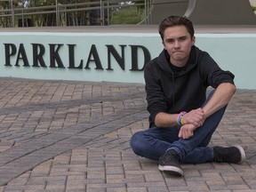 David Hogg, a senior at Marjory Stoneman Douglas High School, poses for a photo at Pine Trails Park, Tuesday, May 29, 2018, in Parkland, Fla. (AP Photo/Wilfredo Lee)