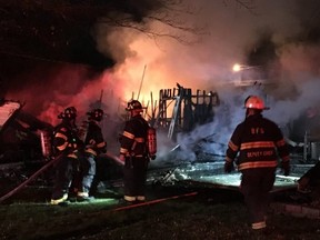Firefighters in Belleville, Ill., attend to the scene of a home explosion in the early morning hours of May 1, 2018.