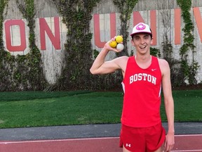 Boston University student Zach Prescott poses with juggling balls after breaking the world record for 'joggling' on May 8, 2018.