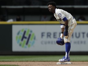 Seattle Mariners' Dee Gordon stands on second base after stealing against the Detroit Tigers, Sunday, May 20, 2018, in Seattle. (AP Photo/Ted S. Warren)
