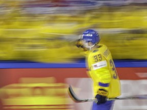 In this picture shot with a slow shutter speed Sweden's Viktor Arvidsson celebrates after scoring his side's first goal during the Ice Hockey World Championships semifinal match between Sweden and the United States at the Royal arena in Copenhagen, Denmark, Saturday, May 19, 2018.