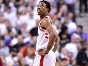 Toronto Raptors guard DeMar DeRozan looks up at the scoreboard during an NBA playoff game against the Cleveland Cavaliers in Toronto on May 3, 2018