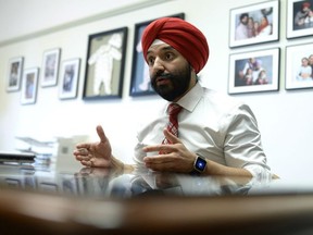 Minister of Innovation, Science and Economic Development Navdeep Bains participates in an interview with the Canadian Press in his Parliament Hill office, in Ottawa on Tuesday, May 1, 2018.