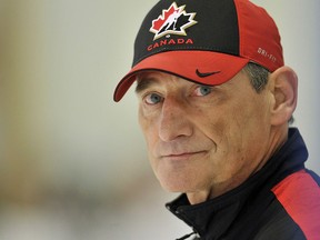 Canada head coach Don Hay looks up ice as he run his team through drills in practice in preparation for the upcoming World Junior Championship in Banff, Alta., on Wednesday, Dec. 21, 2011. (THE CANADIAN PRESS/Nathan Denette)