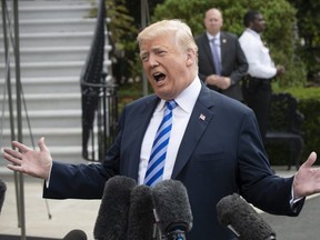 U.S. President Donald Trump talks to the media as he leaves for Dallas to address the National Rifle Association at the White House in Washington, Friday, May 4, 2018.