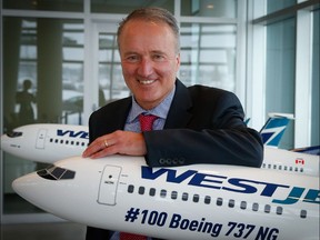 WestJet President and CEO, Ed Sims, poses for a photo in the lobby the company's headquarters on Monday, April 16, 2018 in Calgary. (Al Charest/Postmedia Network)