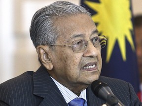 Malaysian Prime Minister Mahathir Mohamad speaks during a press conference after a cabinet meeting in Putrajaya, Malaysia, Wednesday, May 30, 2018. (AP Photo/Sadiq Asyraf)