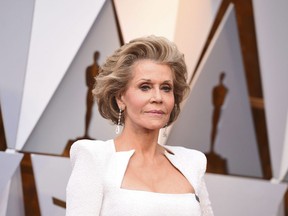 Jane Fonda arrives at the Oscars on Sunday, March 4, 2018, at the Dolby Theatre in Los Angeles. Jane Fonda says she's onboard for a remake of "9 to 5." "We're working on it," the two-time Oscar-winning actress told