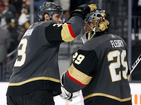 Vegas Golden Knights defenceman Brayden McNabb, left, celebrates with goaltender Marc-Andre Fleury after the team's 4-2 win against the Winnipeg Jets Wednesday, May 16, 2018, in Las Vegas. (AP Photo/John Locher)
