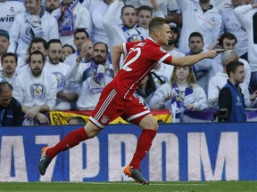 Bayern's Joshua Kimmich celebrates after scoring the opening goal during the Champions League semifinal against Real Madrid at the Santiago Bernabeu stadium in Madrid, Tuesday, May 1, 2018.