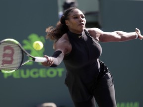 In this Wednesday, March 21, 2018 file photo, Serena Williams returns to Naomi Osaka, of Japan, during the Miami Open tennis tournament, in Key Biscayne, Fla.