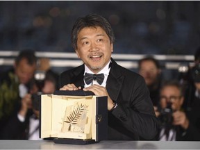 Director Hirokazu Kore-eda holds the Palme d'Or for the film 'Shoplifters' following the awards ceremony at the 71st international film festival, Cannes, southern France, Saturday, May 19, 2018.