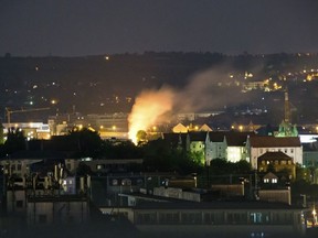 In this May 23, 2018 photo a burning spot lights in the Easter German City Dresden, after an attempt to defuse a Second World War bomb by remote control leads to a partial detonation of the bomb. German police confirmed the bomb that partially exploded during its diffusing has been successfully deactivated. (Marco Klinger/dpa via AP)
