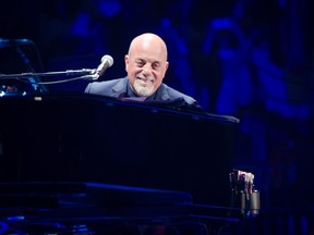 Billy Joel performs at Madison Square Garden in New York on May 9, 2014. (Scott Roth/Invision/AP)