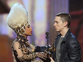 Rapper Nicki Minaj (L) presents Eminem the Best Rap Album Award for "Recovery" onstage during The 53rd Annual GRAMMY Awards held at Staples Center on February 13, 2011 in Los Angeles, California.  (Kevin Winter/Getty Images)