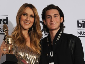 Celine Dion (L), recipient of the Icon Award, and Rene-Charles Angelil pose in the Photo Room during the 2016 Billboard Music Awards at the T-Mobile Arena, in Las Vegas, Nevada, on May 22, 2016. / AFP PHOTO / BRYAN HARAWAY (Photo credit should read BRYAN HARAWAY/AFP/Getty Images)