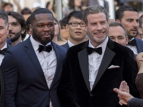 Curtis '50 Cent' Jackson and John Travolta attend the premiere for "Solo: A Star Wars Story" at the festival de palais during the 71st Cannes Film Festival.