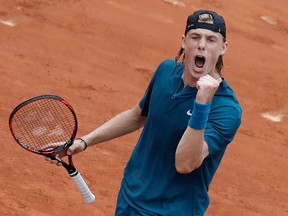 Canada's Denis Shapovalov celebrates winning against John Millman of Australia during their first round match of the French Open at the Roland Garros stadium on May 29, 2018