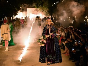 A model presents a creation for Gucci during the 2019 Gucci Croisiere (Cruise) fashion show on May 30, 2018 at Alyscamps in Arles. (BERTRAND LANGLOIS/AFP/Getty Images)