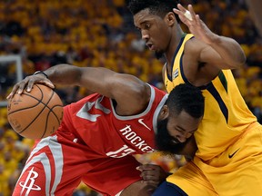 James Harden of the Houston Rockets drives into defender Donovan Mitchell of the Utah Jazz at Vivint Smart Home Arena on May 6, 2018 in Salt Lake City. (Gene Sweeney Jr./Getty Images)